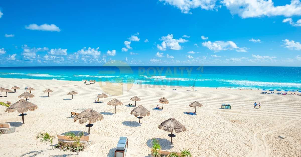scenic-beach-with-calm-blue-ocean-water-and-fluffy-white-clouds-in-a-clear-blue-sky-plan-your-trips-to-mexico